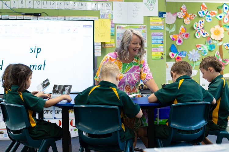 Miss Fist teaching a group of students