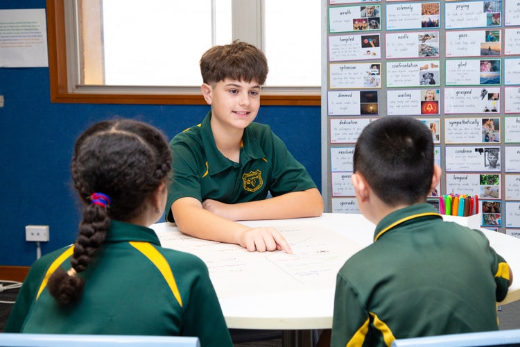 Three students learning together.